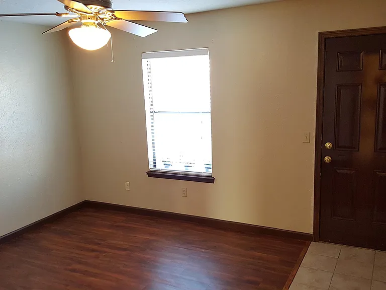 Master Bedroom with walk in closet and door to backyard