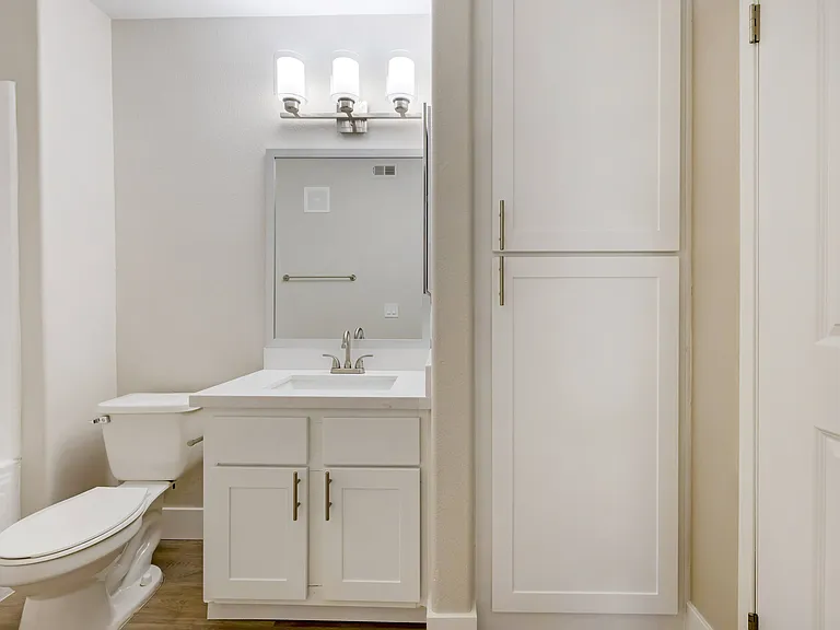 Each bathroom features sleek cabinetry, contemporary fixtures, and stunning tile work, creating a spa-like atmosphere.