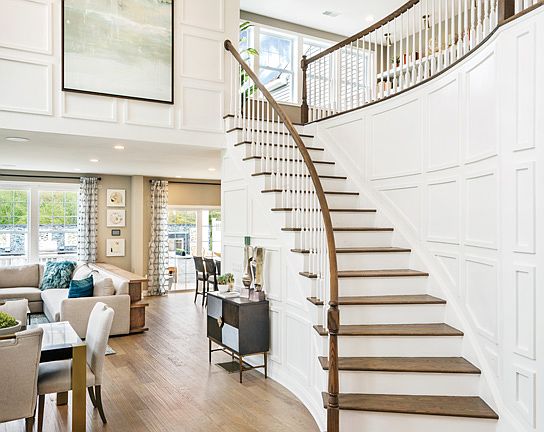 Two-story foyer with curved staircase