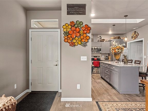 home has hardwood finishes, beautiful kitchen, open concept and great natural light with plenty of windows.  