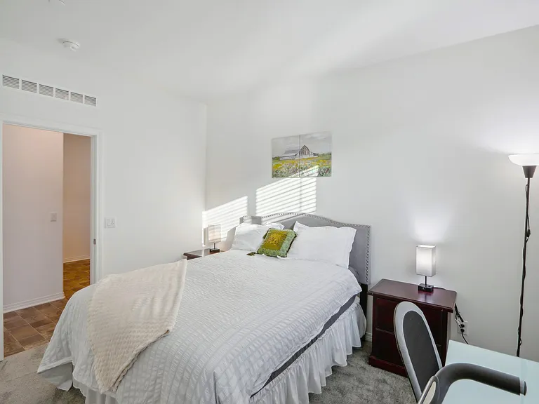 Drift off in this charming bedroom, complete with fresh linen.