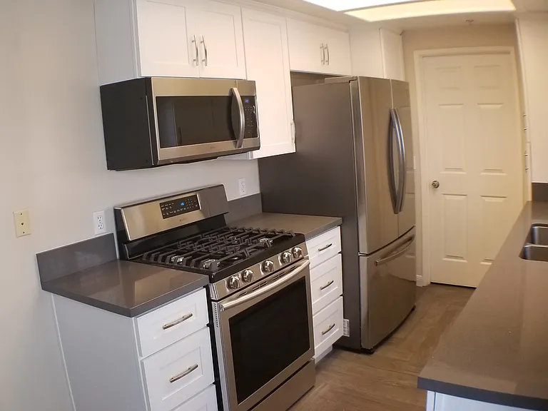 Updated kitchen with newer Cabinets, quartz counters, and Stainless Steel appliances