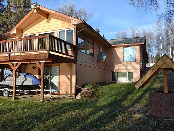 View of South and East side of house. Dish antenna currently inactive. JetSki not included in rental.