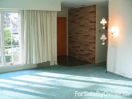 LR view of front door closet & foyer