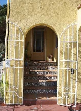 arched entryway with decorative tiles
