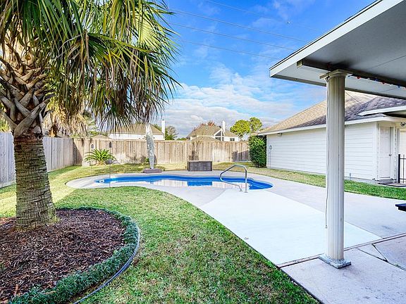 Large Backyard, Pool, Palm Trees extended covered patio perfect to entertain.