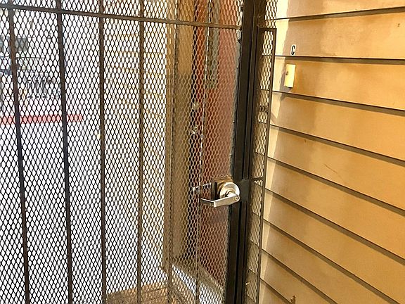 Entrance located behind a locked gate for extra security.