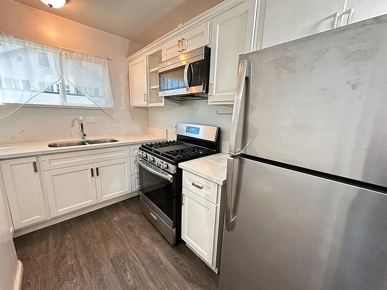 Updated kitchen with modern appliances (stainless steel)