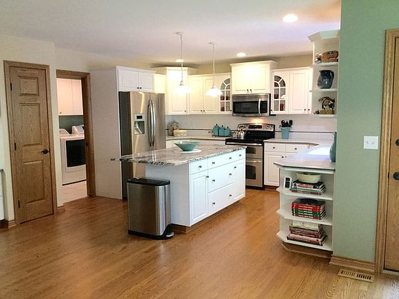 Beautiful hardwood flooring in the kitchen just newly refinished