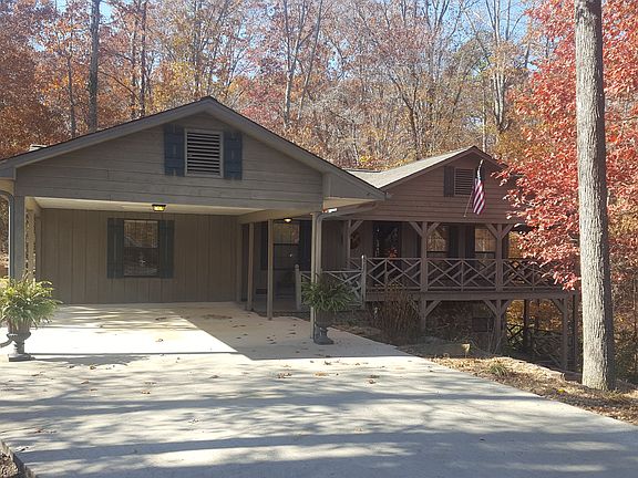 NESTLED ON SHADY ACREAGE