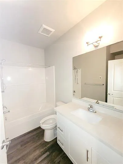 #12 Bathroom w/ stackable washer & dryer.