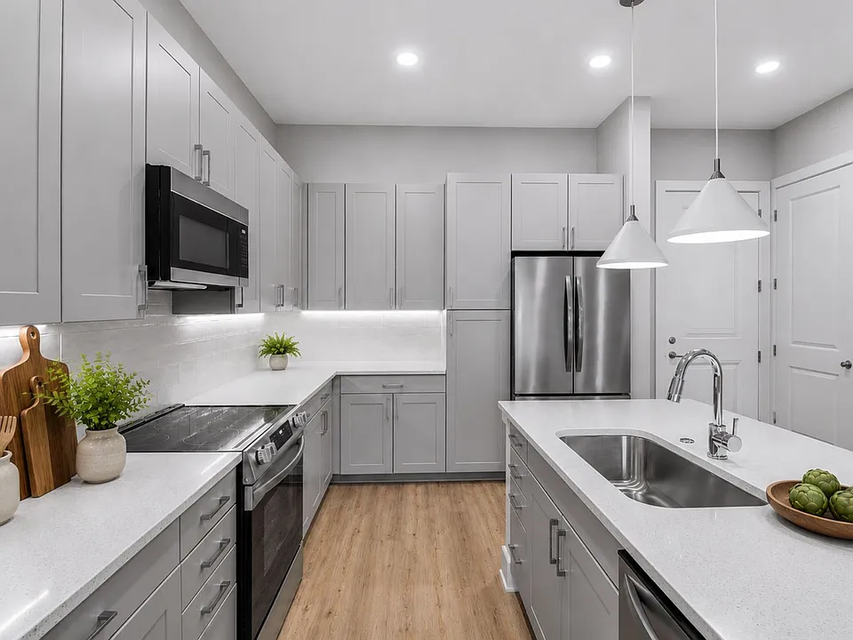 Quartz countertops, stainless steel appliances, and effortless style this kitchen sets the tone for boundless living.