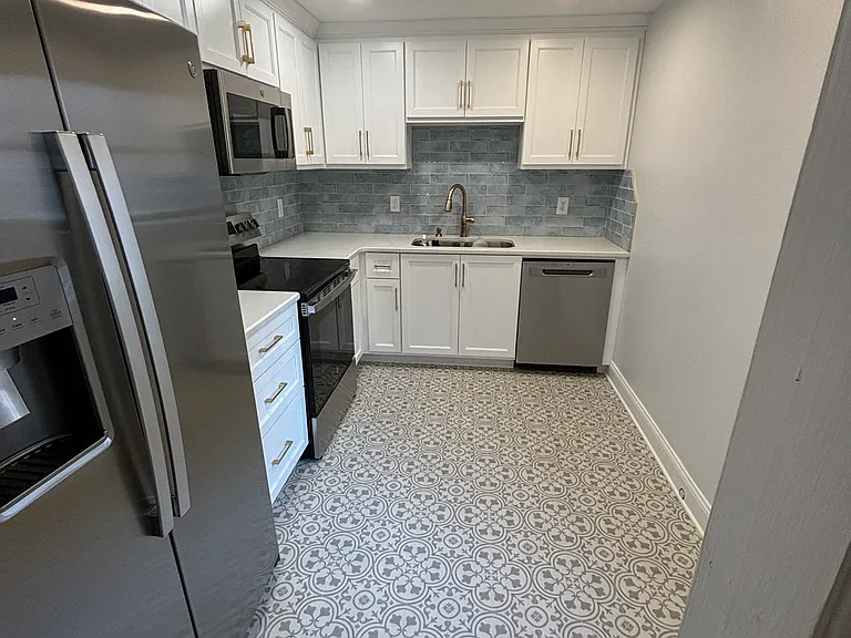 New vinyl flooring, kitchen cabinets, and appliances.