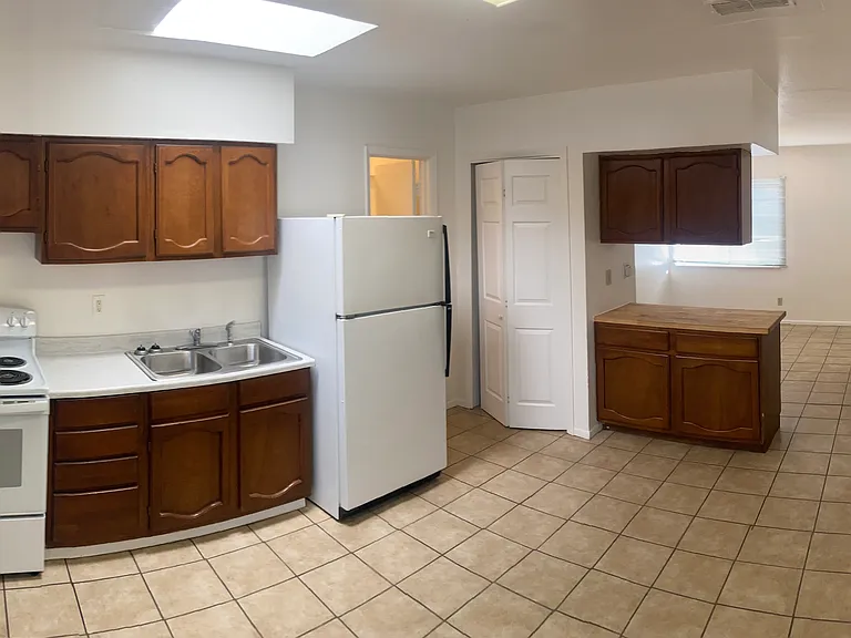 Clean updated Kitchen & Studio looking south to Bedroom