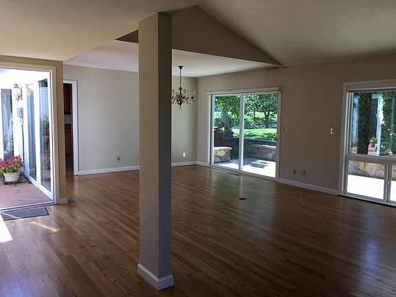 View from entry to dining room, living room and back patio
