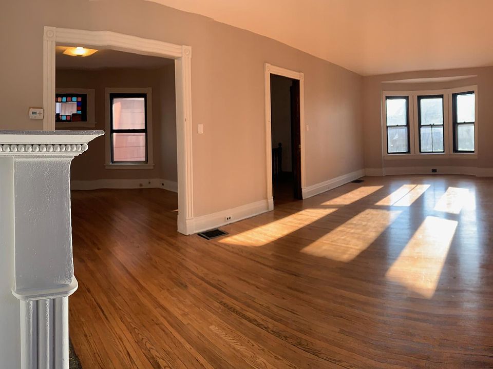 Living Room from Bedroom 1 door; entry to dining room on left, door to stairwell in center.