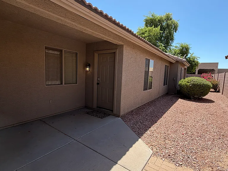 Private courtyard entry behind lockable gate.