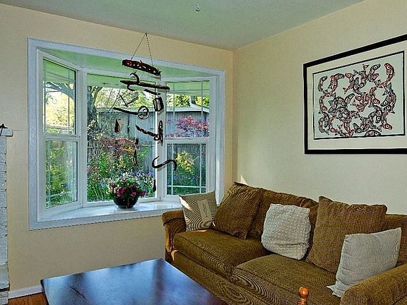 Garden Window Overlooking Lush Yard