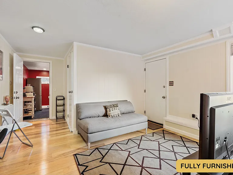 Downstairs is a large bedroom with ensuite full bathroom, queen bed, smart TV, sitting area, wall table, desk & chair, dresser, XL closet, large windows and an exterior door onto the backyard. Also connects to the laundry and bonus space.
