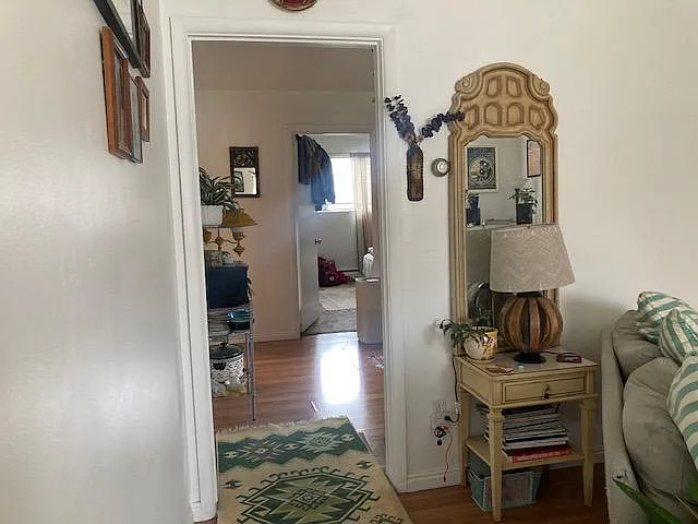 view from living room into kitchen toward bedroom
