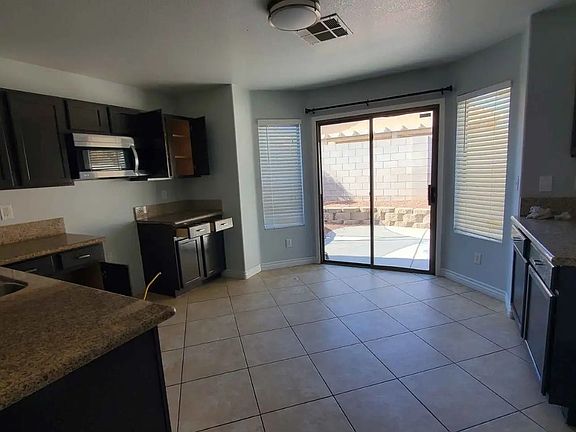 Kitchen comes with new stainless appliances.