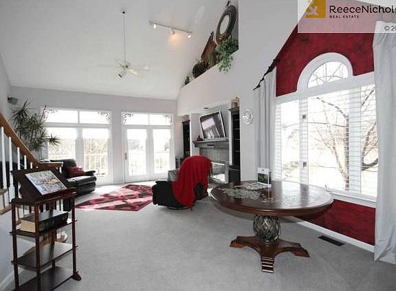 Sunny Living Room/Dining Room With Soaring Ceilings & Deck Overl