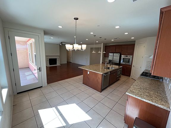 huge kitchen with island, area for dining table and open to family room