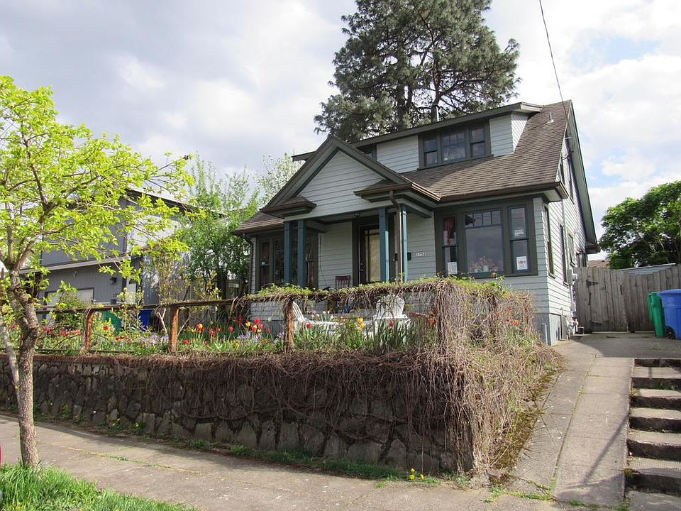 The 1930's bungalow is rented separately. Apartment entrance is up the driveway, through