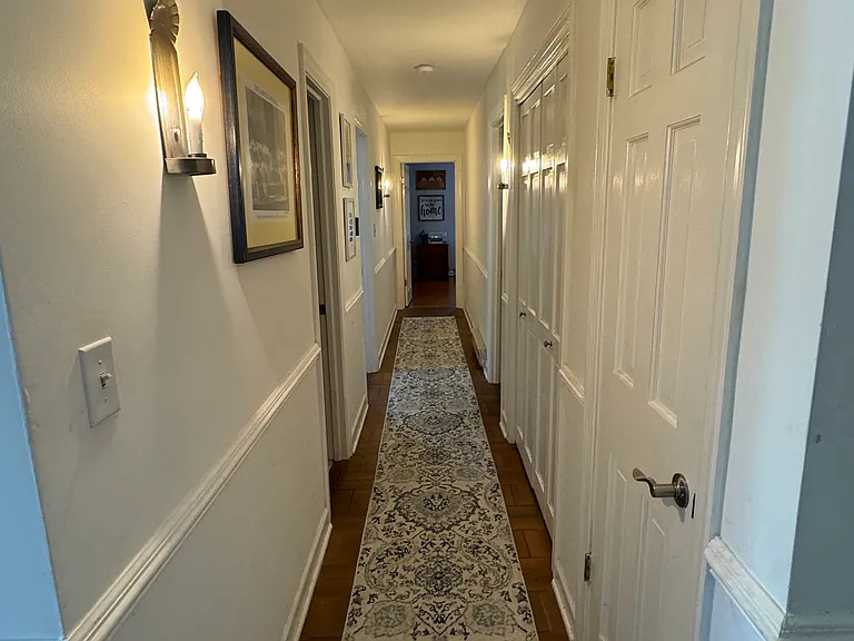 Downstairs hallway to 1 bedroom (Left), 1 Bathroom with shower and tub (Left), 1 bedroom/office suite with private bathroom (Right and straight ahead because there are two door ways)