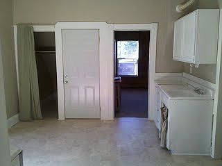 Kitchen looking toward living room and entry door