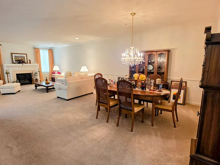 View from the hallway showcasing the exceptional depth, architectural trim, and effortless transition between spaces.