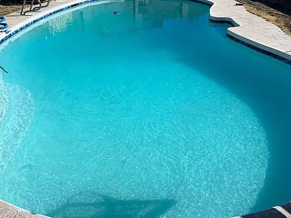 diving pool with diving board and brand new remodel with new plaster and tile