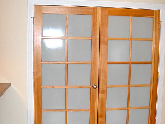 Beautiful focal-point doors lead to bonus room for den / off