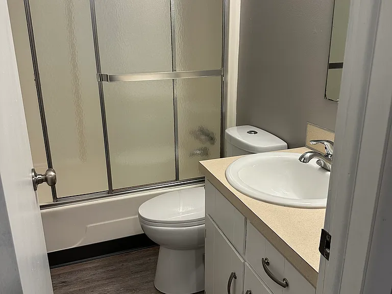 Full bath upstairs in updated townhome.