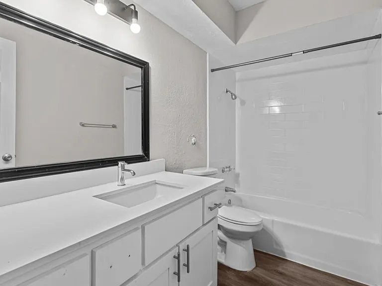 Updated bathroom with modern vanity and lighting