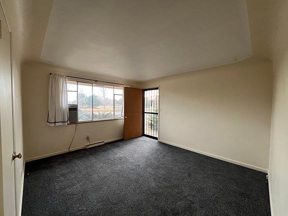 Living room, front door, window air conditioner .