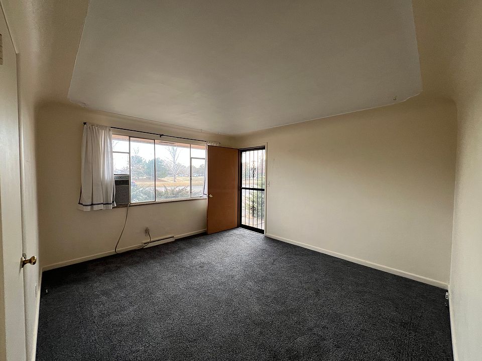 Living room, front door, window air conditioner .
