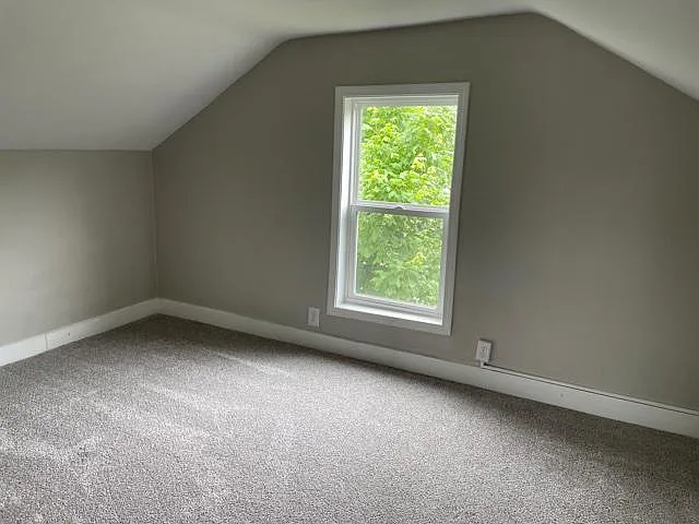 Bedroom upstairs with carpet.