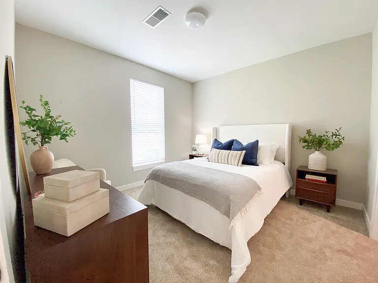 A calm, comfortable bedroom with space to unplug and recharge.