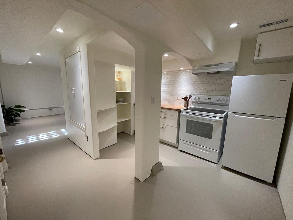 New kitchen, recessed dimmer lights & charming arch details.