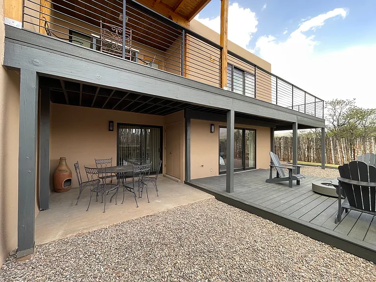 View of the three outdoor living spaces from the back yard.