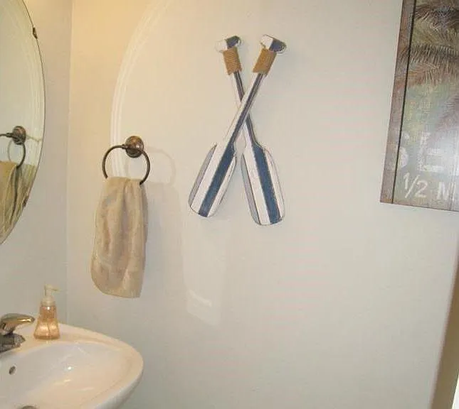 This 2 piece half bath is just off the kitchen, near the garage entry door and laundry room. Washer and dryer included, but can be moved out if you want to bring your own appliances.
