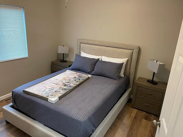 2nd bedroom shown with queen size bed