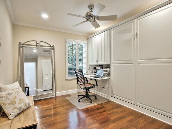 Bedroom with murphy bed and bulid-in desk