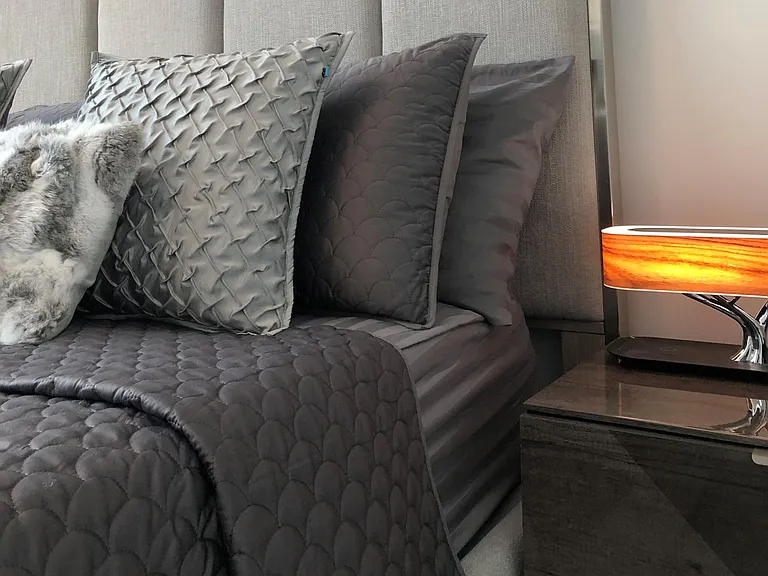 Luxurius bedroom with LED phone charging lamp, laquer italian made night stands and TV