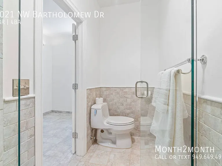 9021 NW Bartholomew Dr — Photo 28