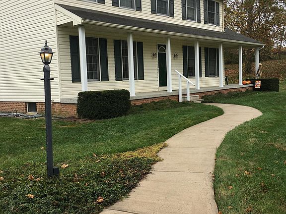 Front view. This is a side by side two unit, the available unit is on the left. The front door opens directly into this unit.