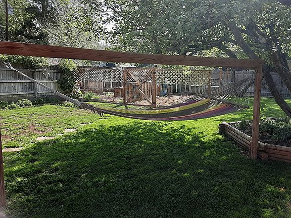 Garden and dog pen, in back