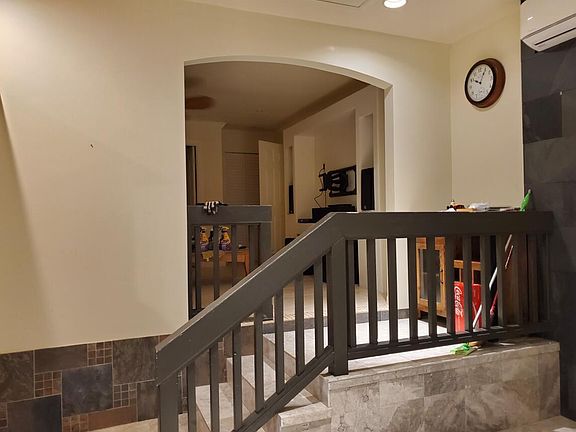 Stairs to TV/Living room and also going to full bathroom and bedrooms.