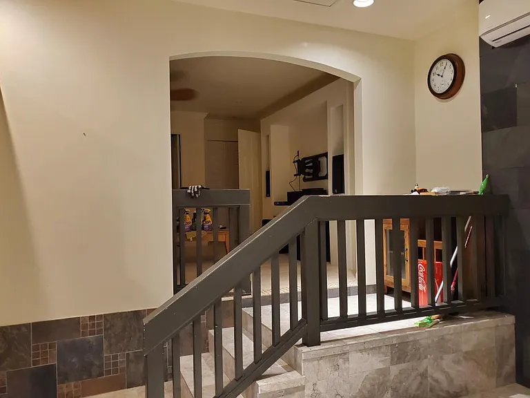 Stairs to TV/Living room and also going to full bathroom and bedrooms.